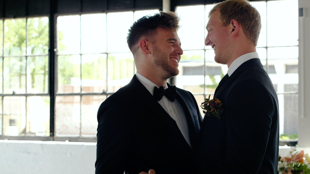 Two men dancing together during a wedding styled shoot