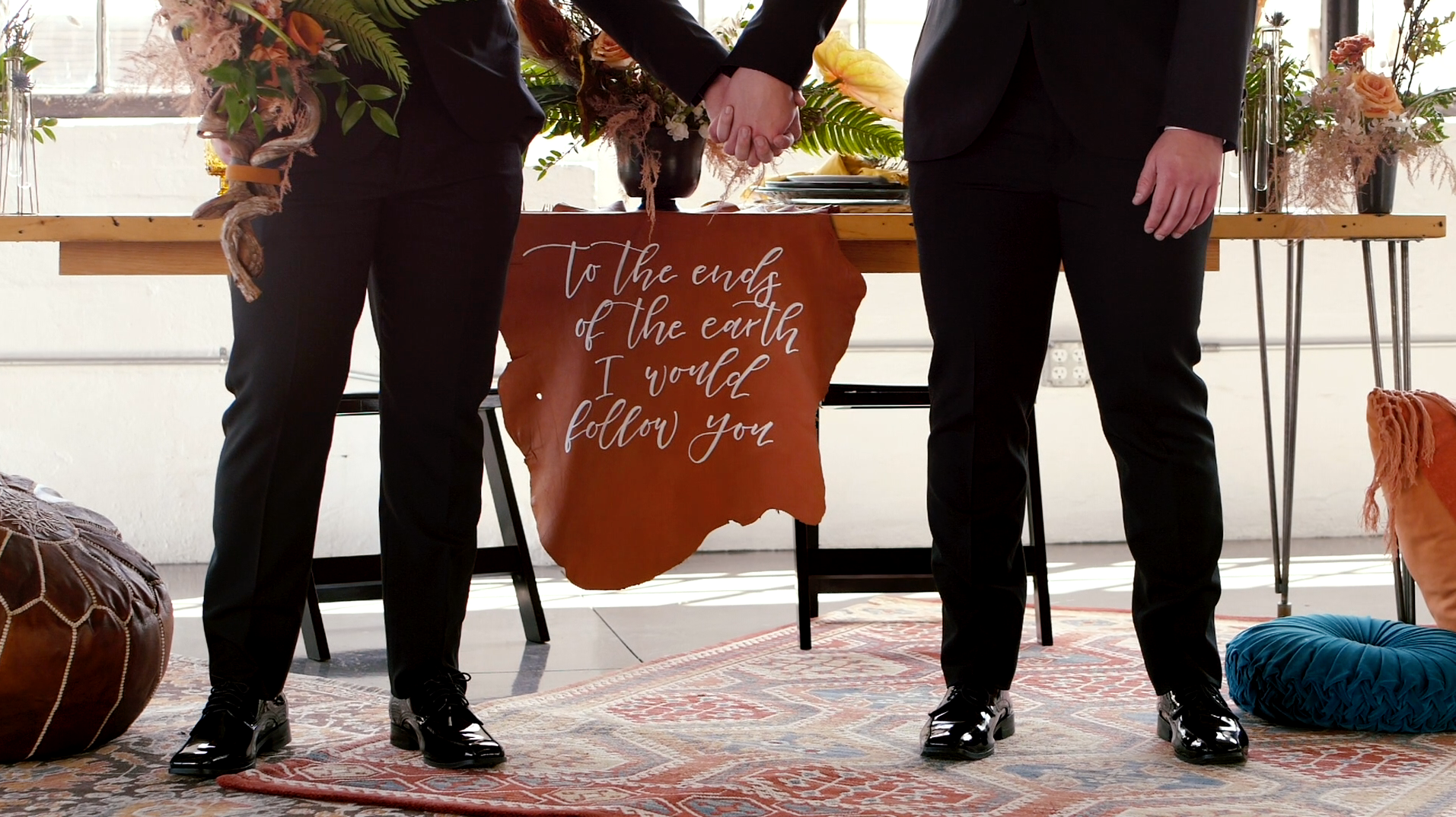 gay men holding hands at wedding styled shoot
